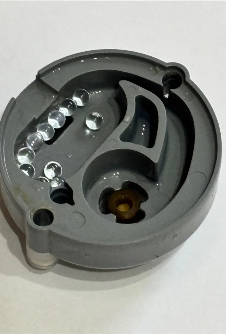 Inside a Halogen cleaning cap, with cleaning media visible around its internal channels