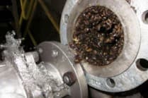 Marine fouling visible at an open pipe and valve connection