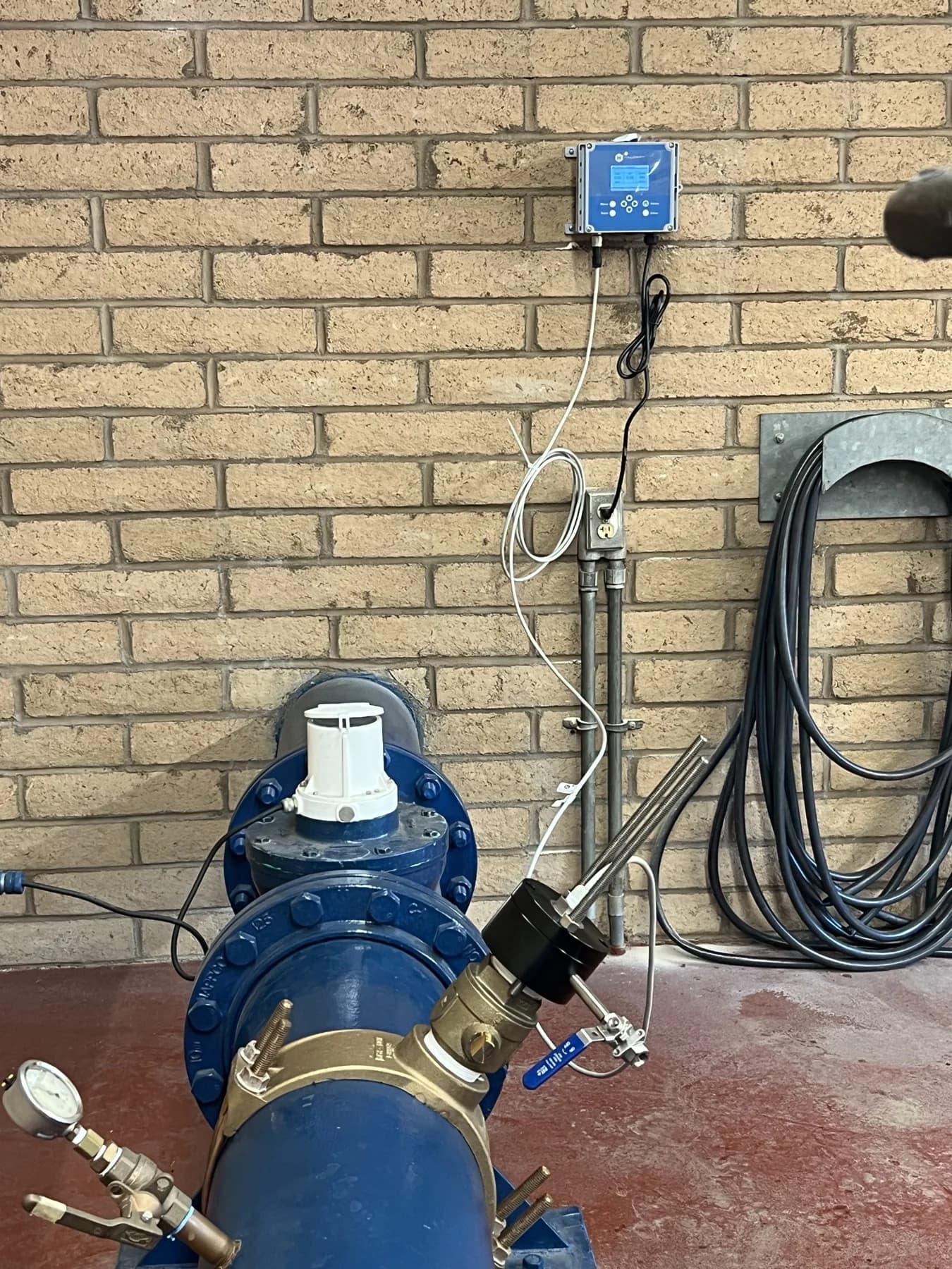 Installed wet-tap sensor and wall-mounted controller